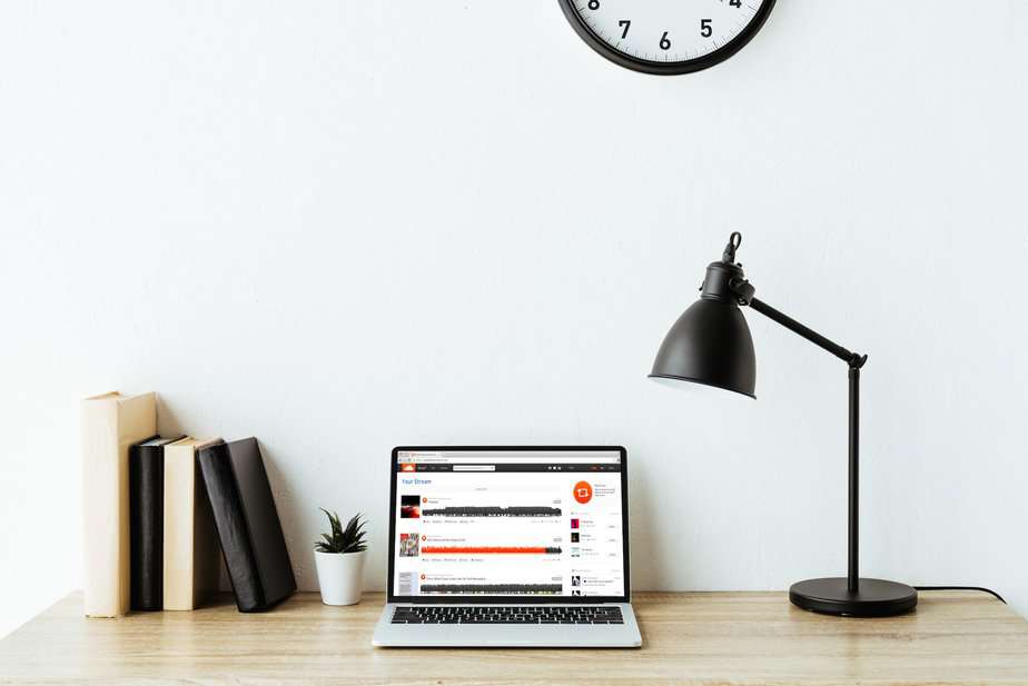 laptop with soundcloud website on screen on work desk at office