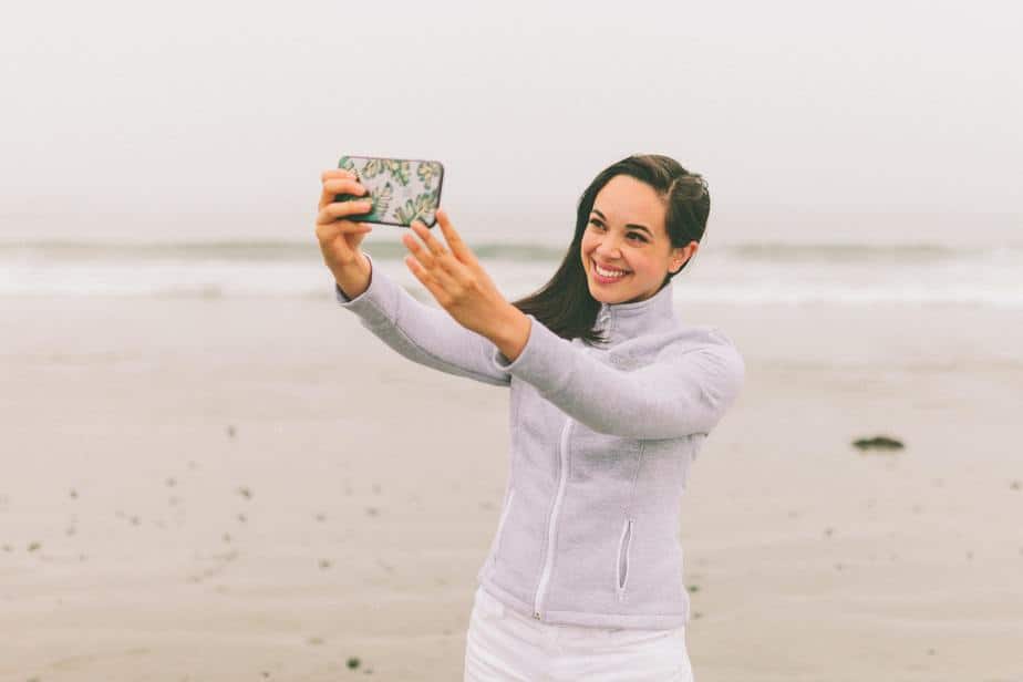 Woman Taking a Selfie at the Beach